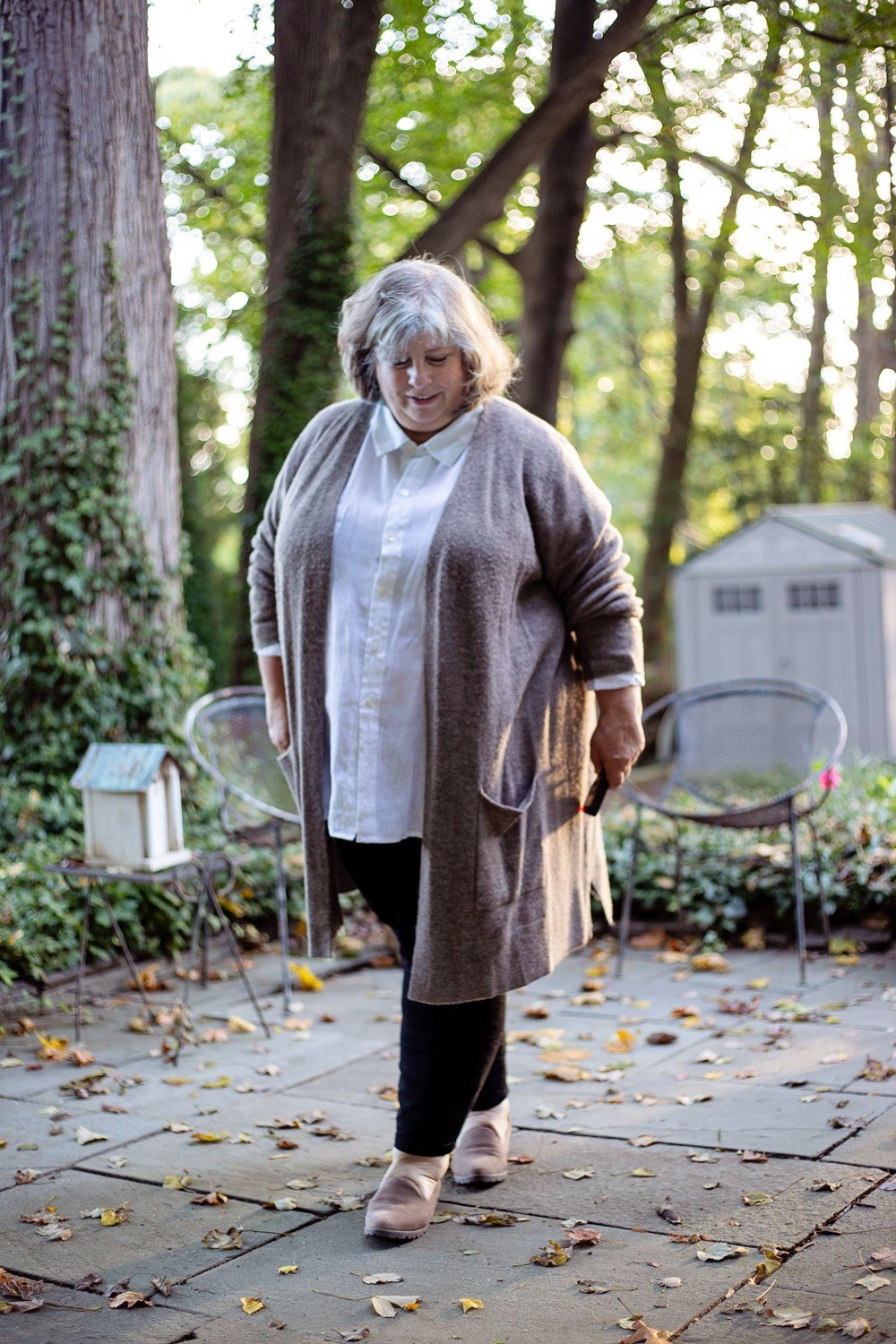 Fall sweater outfit idea 39 for women over 60: gray long cardigan with white top and black pants