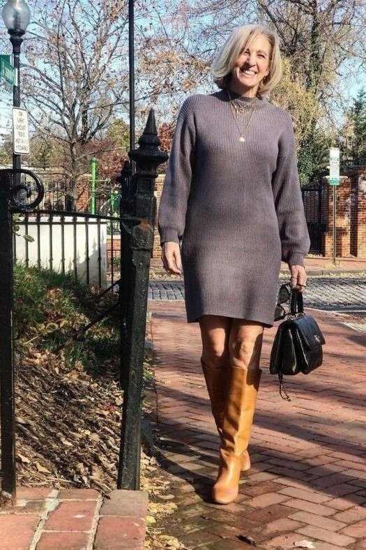 Fall sweater outfit idea 59 for women over 60: gray sweater dress with tan boots