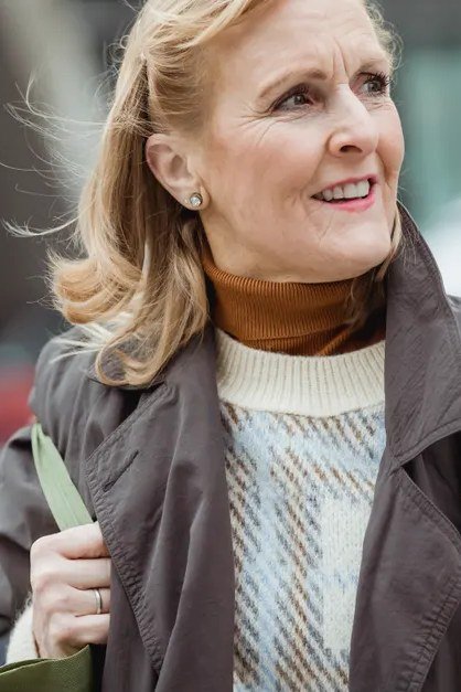 Fall sweater outfit idea 66 for women over 60: brown jacket with cream cable-knit