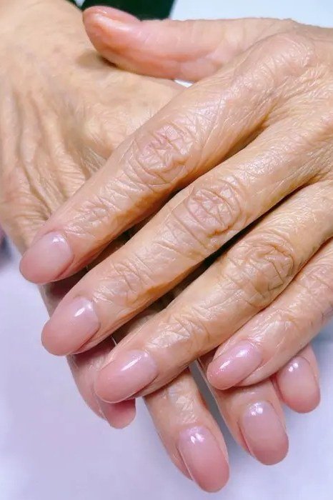 Nude Nails on Spotted Hands - gel nail design for women over 50