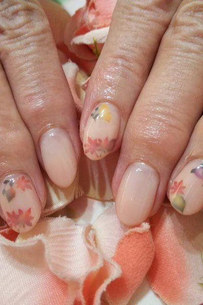 Nude Nails with Floral Accent - gel nail design for women over 50