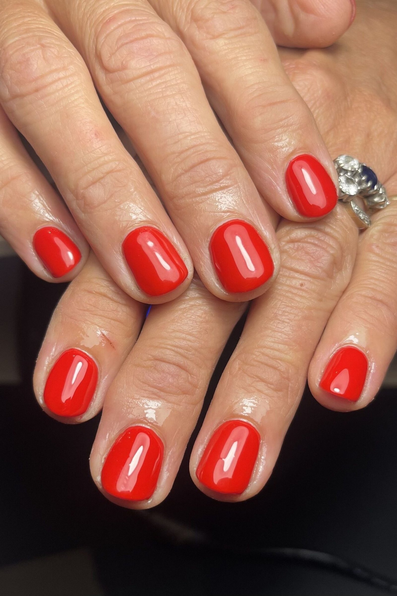 Bright Red Nails with Rings - gel nail design for women over 50