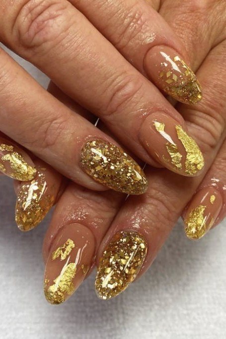Gold foil flake nails with glitter on short oval nails, gold nails for mature older hands