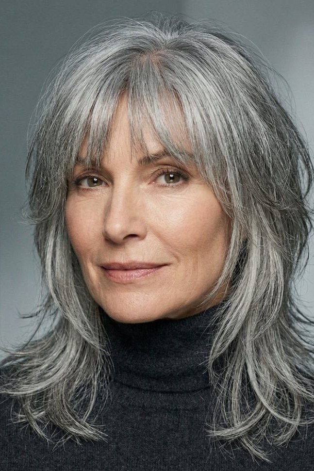 Salt-and-Pepper Layers with Center-Parted Bangs for women over 60, grey hairstyle with bangs