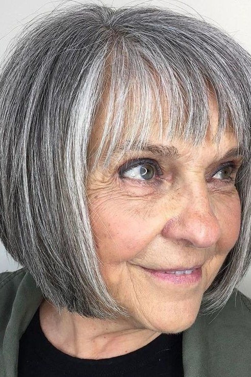 Salt-and-Pepper Rounded Bob with Micro Bangs for women over 60, grey hairstyle with bangs