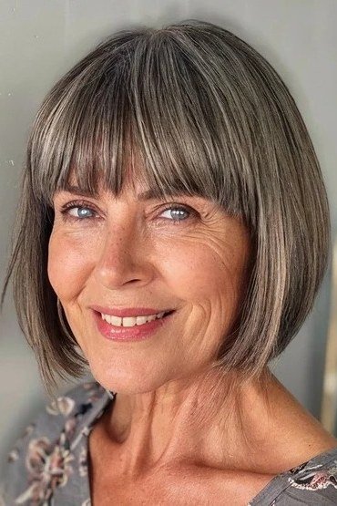 Salt-and-Pepper Bob with Full Straight Bangs for women over 60, grey hairstyle with bangs