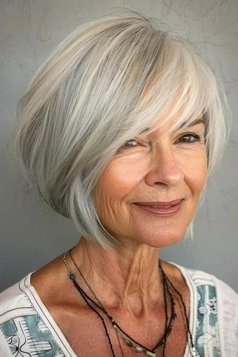 Silver Pixie-Bob with Flirty Side Bangs for women over 60, grey hairstyle with bangs
