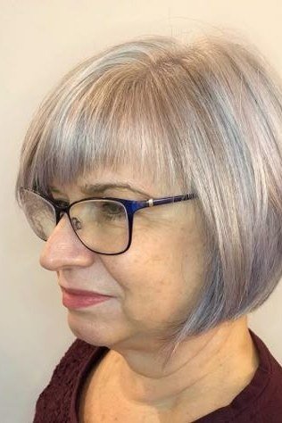 Silver Rounded Bob with Blunt Bangs and Glasses for women over 60, grey hairstyle with bangs