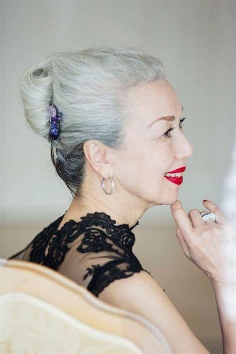 Silver High Bun With Purple Scrunchie - Christmas party hairstyle for women over 60 (silver high bun with purple scrunchie, side view)