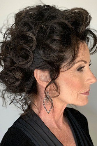 Black Curly Updo - Christmas party hairstyle for women over 60 (black curly updo, side view)