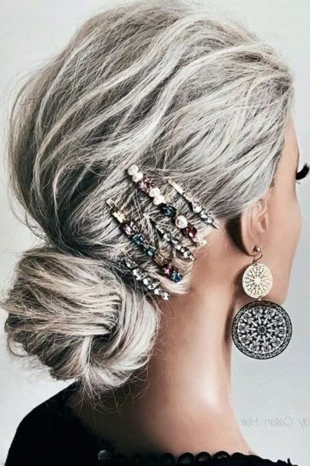 Silver Low Bun With Stacked Jeweled Side Combs - Christmas party hairstyle for women over 60 (silver low bun with stacked jeweled side combs, side view)