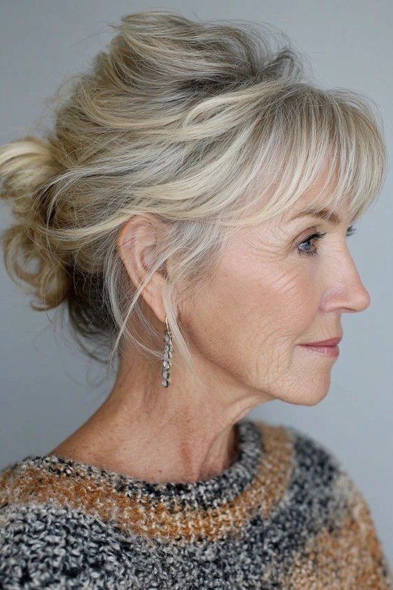 Elegant grey twisted updo hairstyle for women over 50