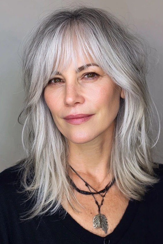 Silver shaggy layered haircut for women over 50