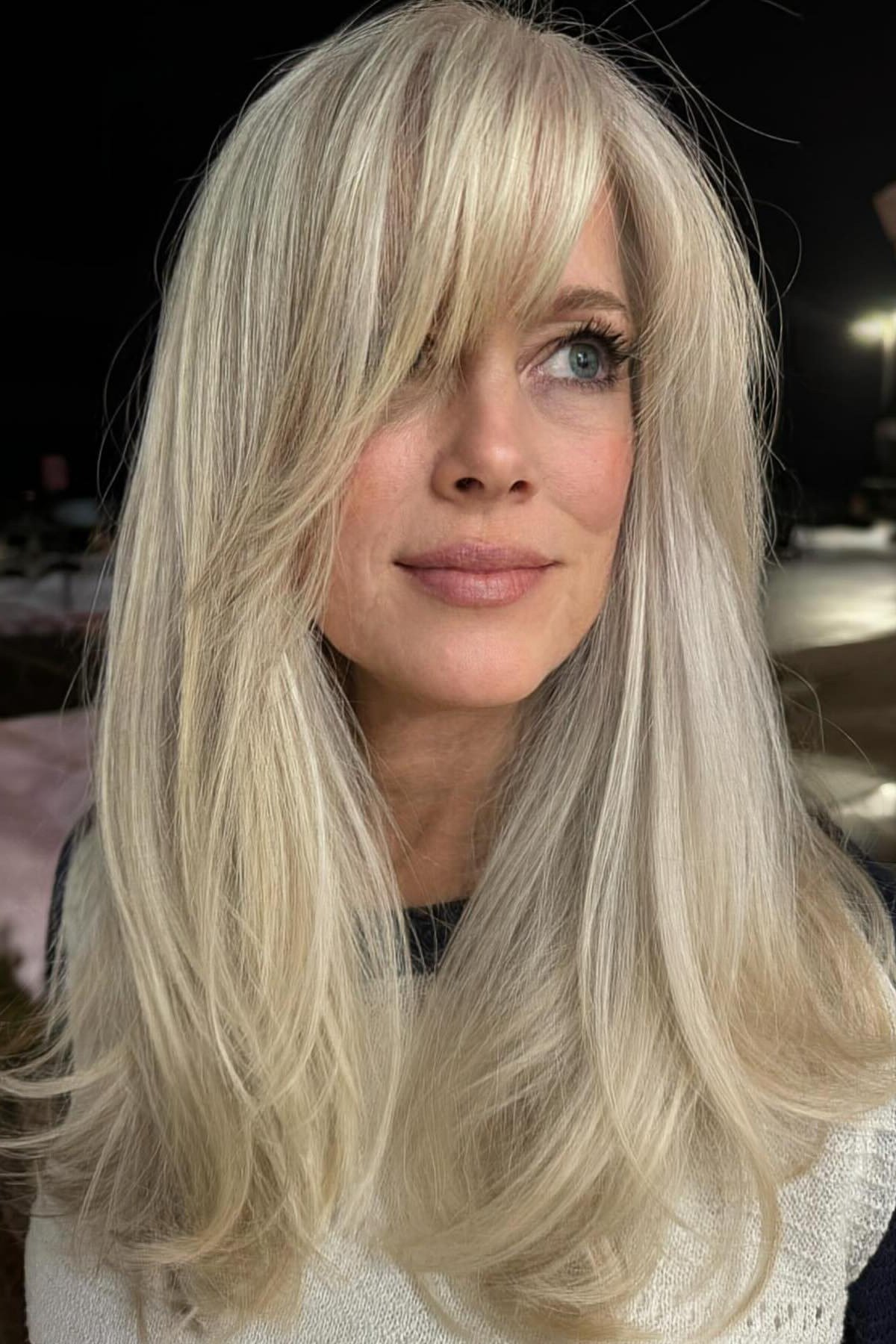 Platinum long straight hair with bangs for women over 50