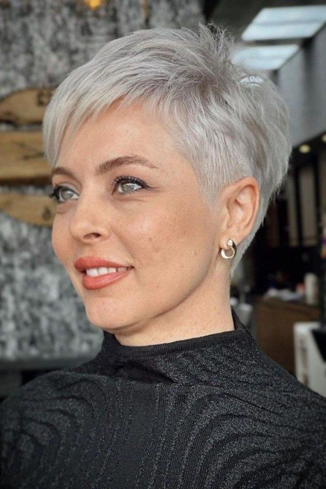 Salon-styled silver pixie cut, smiling