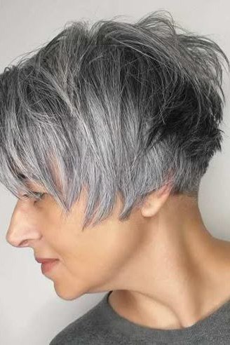 Rounded silver pixie haircut, side view