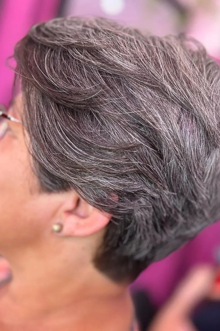 Lavender-gray pixie haircut with glasses, side view