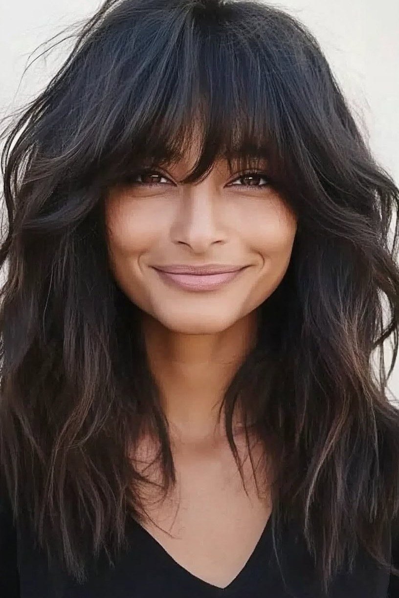 Voluminous Dark Waves with Curtain Bangs - curtain bangs hairstyle for women over 40