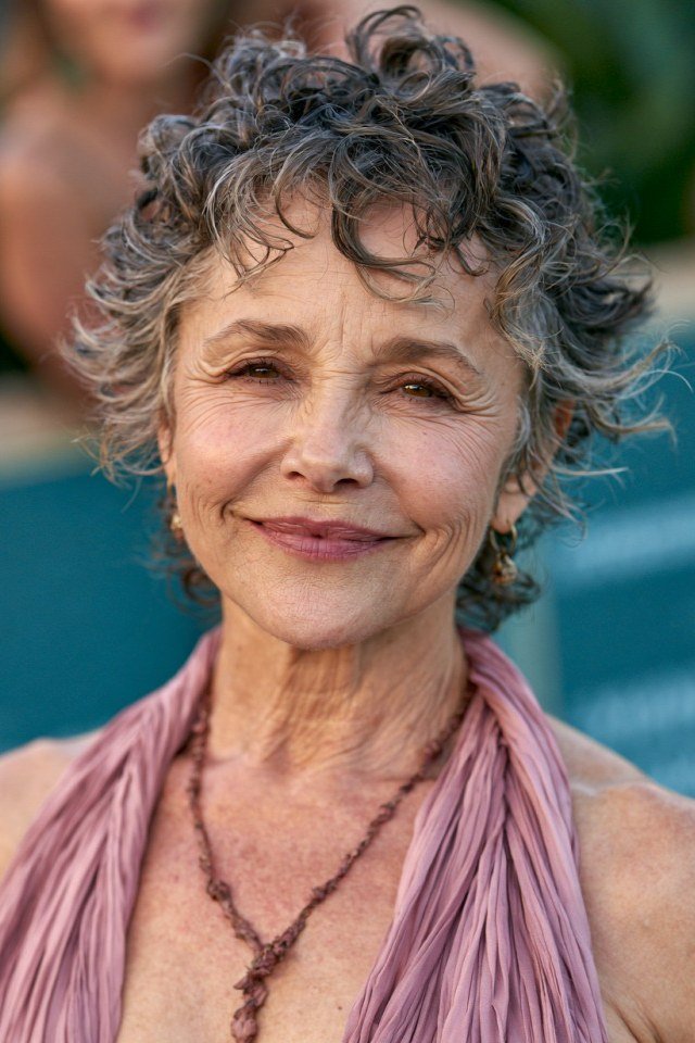 Silver curly pixie with pink scarf, front view