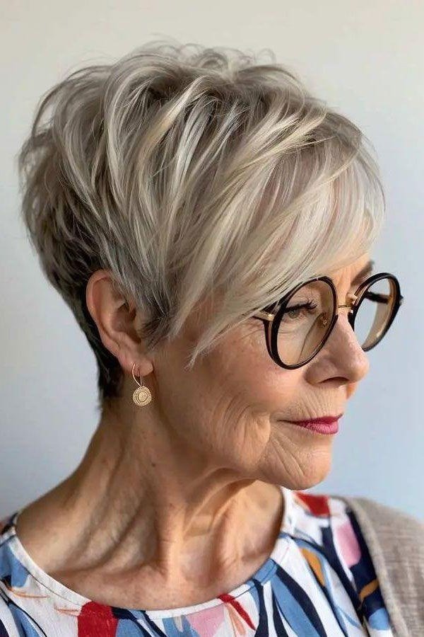 Blonde pixie haircut with glasses, side profile view