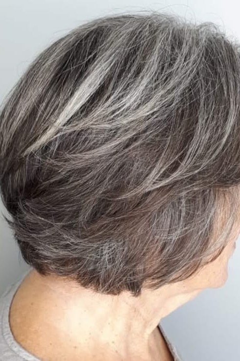 Salt-and-pepper shaggy bob haircut, side profile view