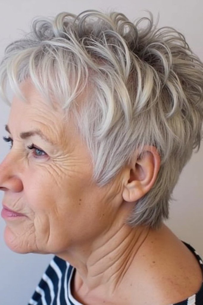 Silver spiky pixie haircut, side profile view