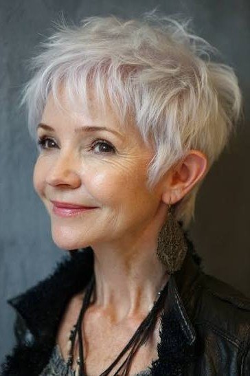 Silver shaggy pixie haircut for women over 60, front view