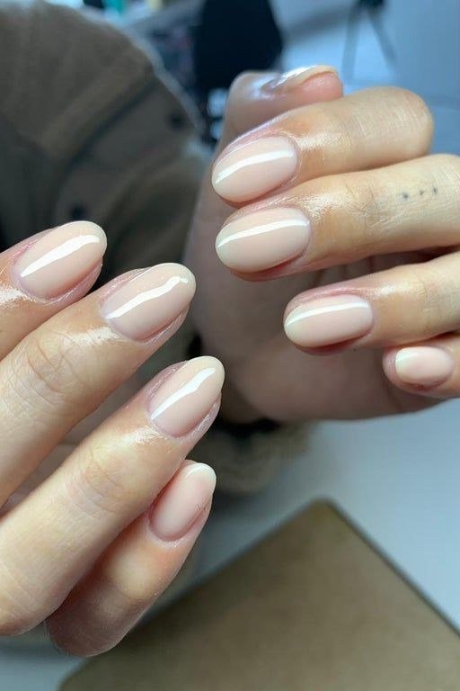 classic white french tips on nude almond nails - honey glazed nude nails for women over 50