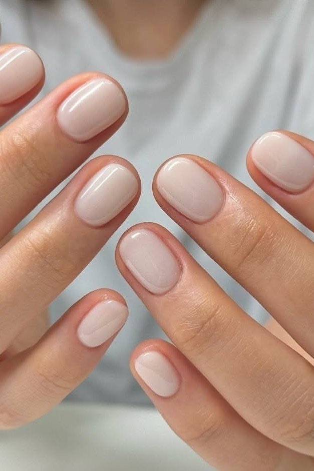 pale nude short oval nails - honey glazed nude nails for women over 50