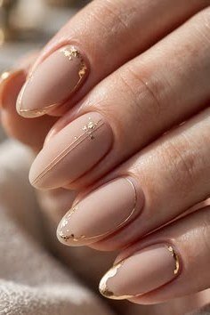 nude almond nails with gold rim details - honey glazed nude nails for women over 50