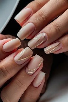 nude almond nails with a french outline - honey glazed nude nails for women over 50