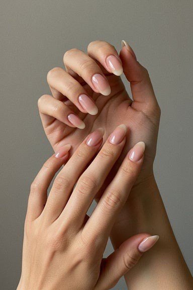 simple nude almond nails for mature hands - honey glazed nude nails for women over 50