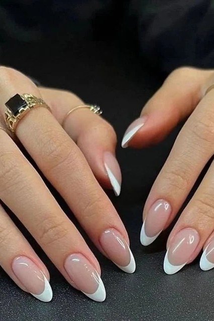 white french almond nails with rings - honey glazed nude nails for women over 50