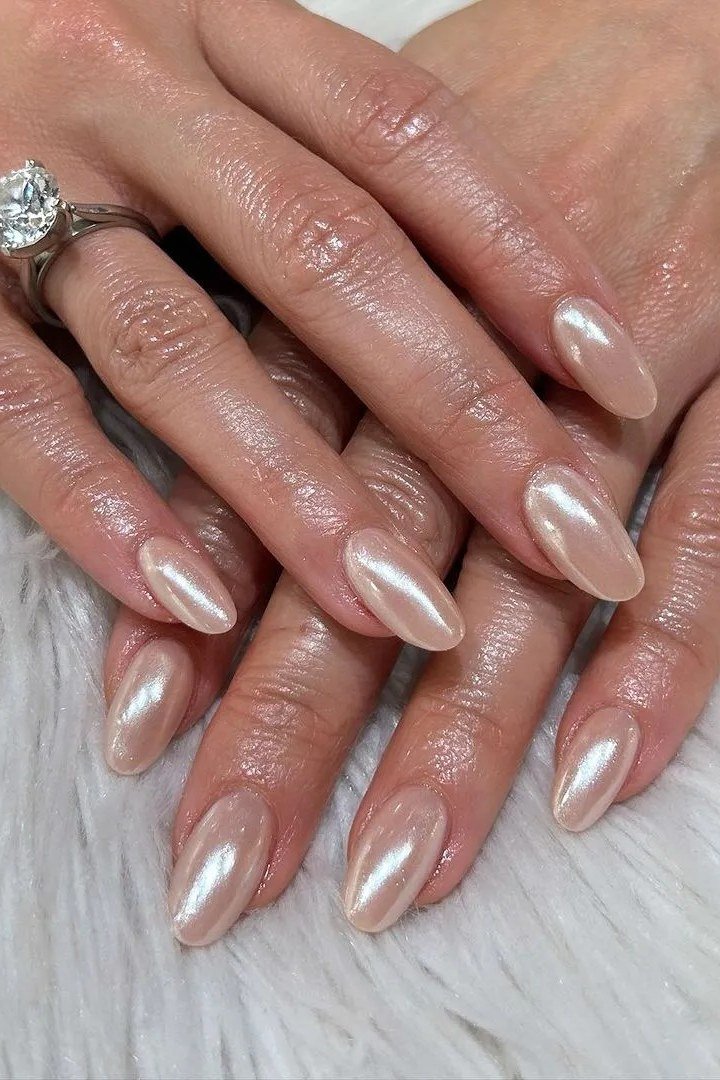 pearl chrome nails with your favorite rings - honey glazed nude nails for women over 50