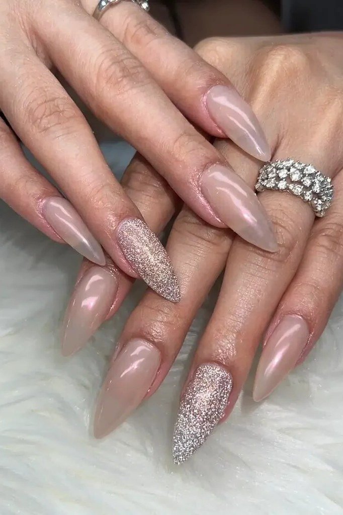 mauve chrome nails with a glitter accent - honey glazed nude nails for women over 50