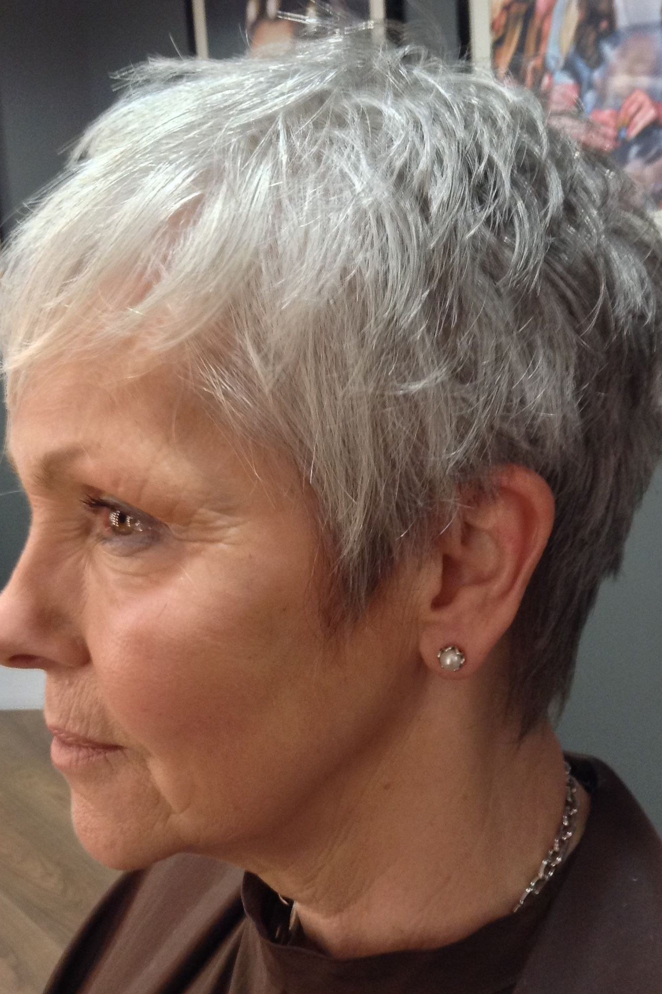 soft wispy silver pixie with side swept fringe for women over 60