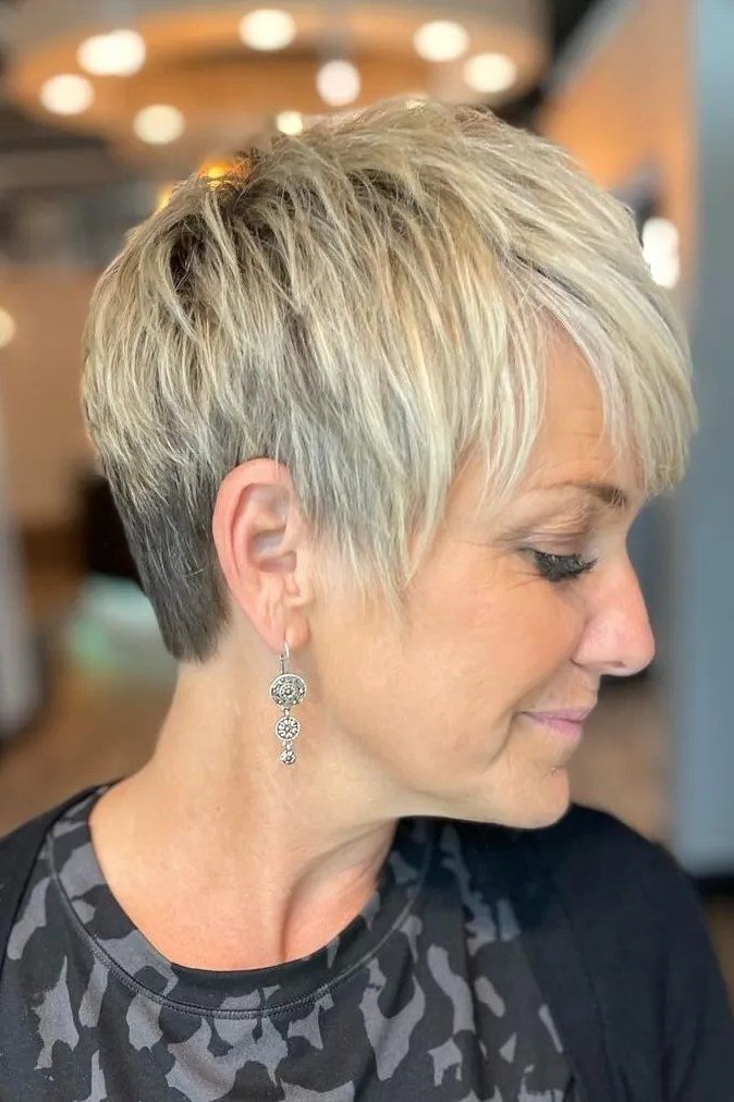 Neat short blonde pixie for women over 40, side view