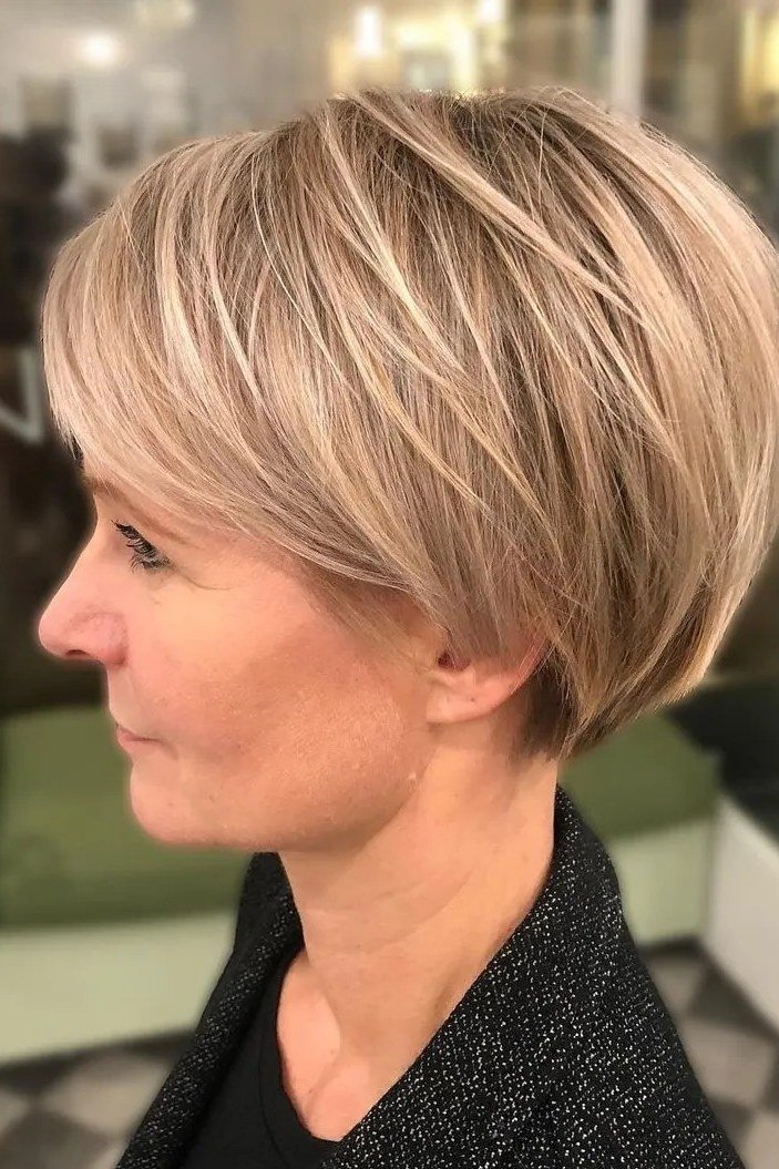 Blonde pixie bob haircut for women over 40, side view