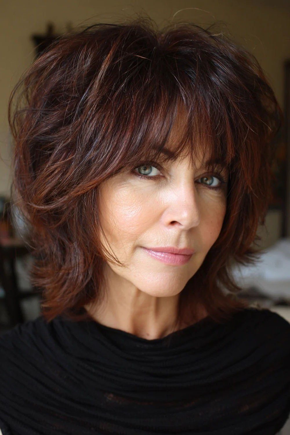Auburn short shaggy bob with bangs for senior women