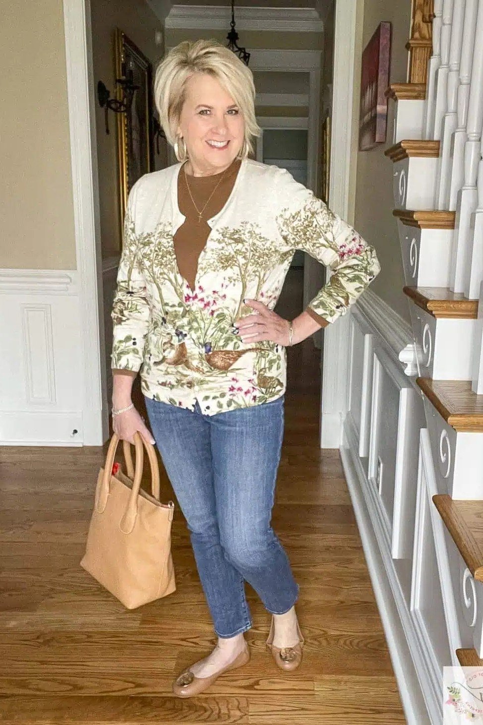 Thanksgiving outfit for women over 50: floral kimono jacket on stairs