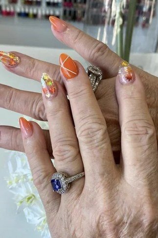 Bright Orange Nails with Pumpkin Art for women over 50