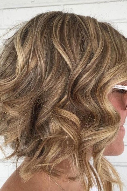 Honey blonde wavy bob for women over 40, side view