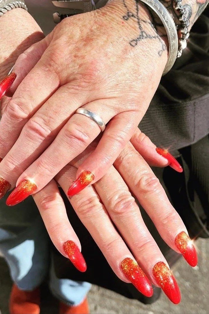 Red Nails with Orange Glitter Ombre Tips for women over 50
