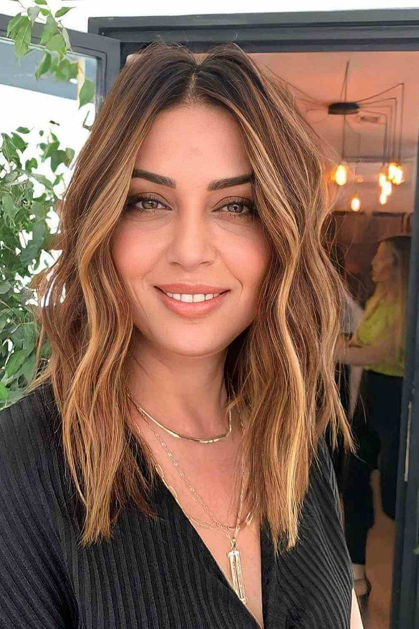 Chestnut wavy lob hairstyle for women over 40
