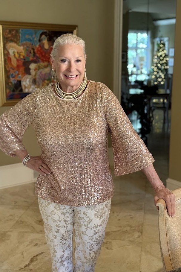 Thanksgiving outfit for women over 50: champagne sequin top with lace pants