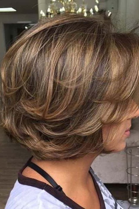 Highlighted stacked bob haircut for women over 40, side view