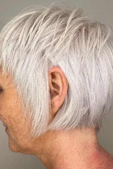 Neat white short shaggy bob hairstyle for older women
