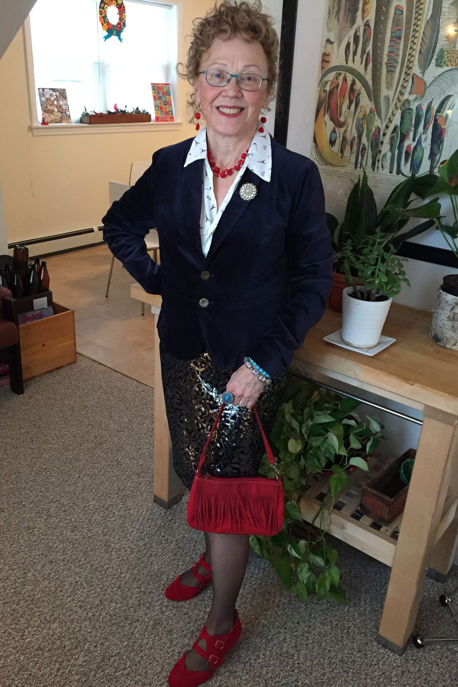 Thanksgiving outfit for women over 50: navy blazer with floral skirt