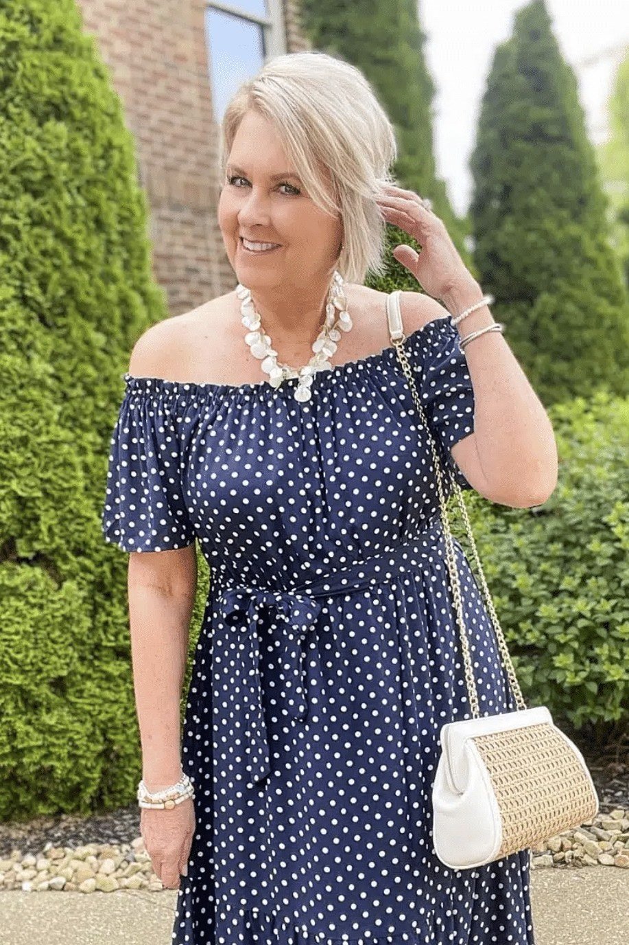 Navy polka-dot off-shoulder dress