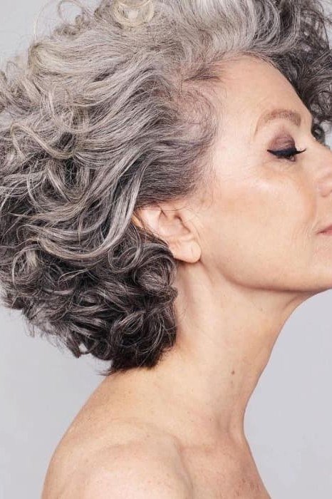 swept back silver curly bouffant for women over 60